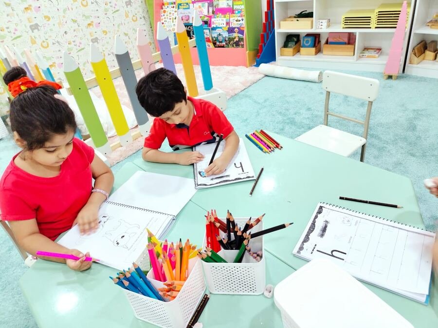 Children practicing handwriting at their desks